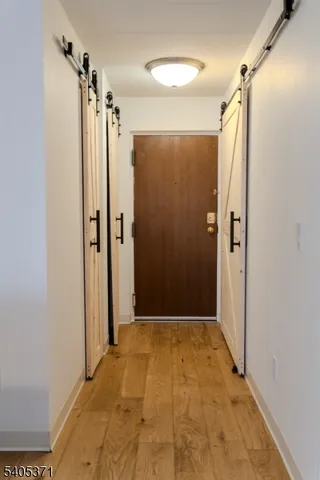 a bathroom with a shower and a glass door