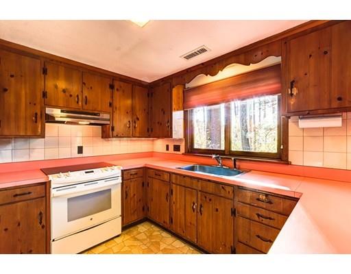 5 Edgebrook Road Framingham, MA 01701 - Photo 18 of 32 a kitchen with stainless steel appliances granite countertop a stove a sink and a microwave