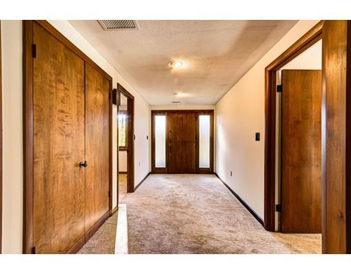 5 Edgebrook Road Framingham, MA 01701 - Photo 21 of 32 a view of a hallway with wooden shelves