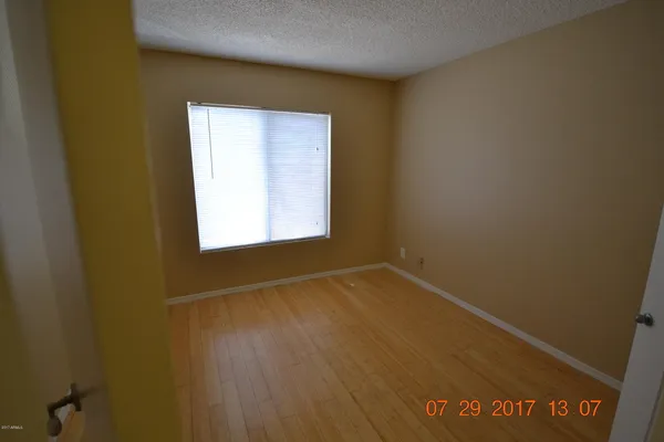 a bathroom with a sink a mirror and a toilet