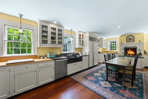 a kitchen with stainless steel appliances granite countertop a stove and a sink