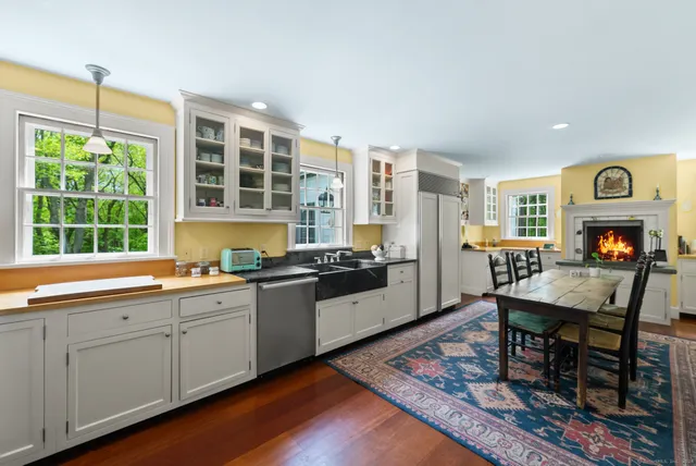 a kitchen with stainless steel appliances granite countertop a stove and a sink