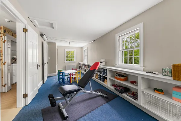 a livingroom with furniture and a window