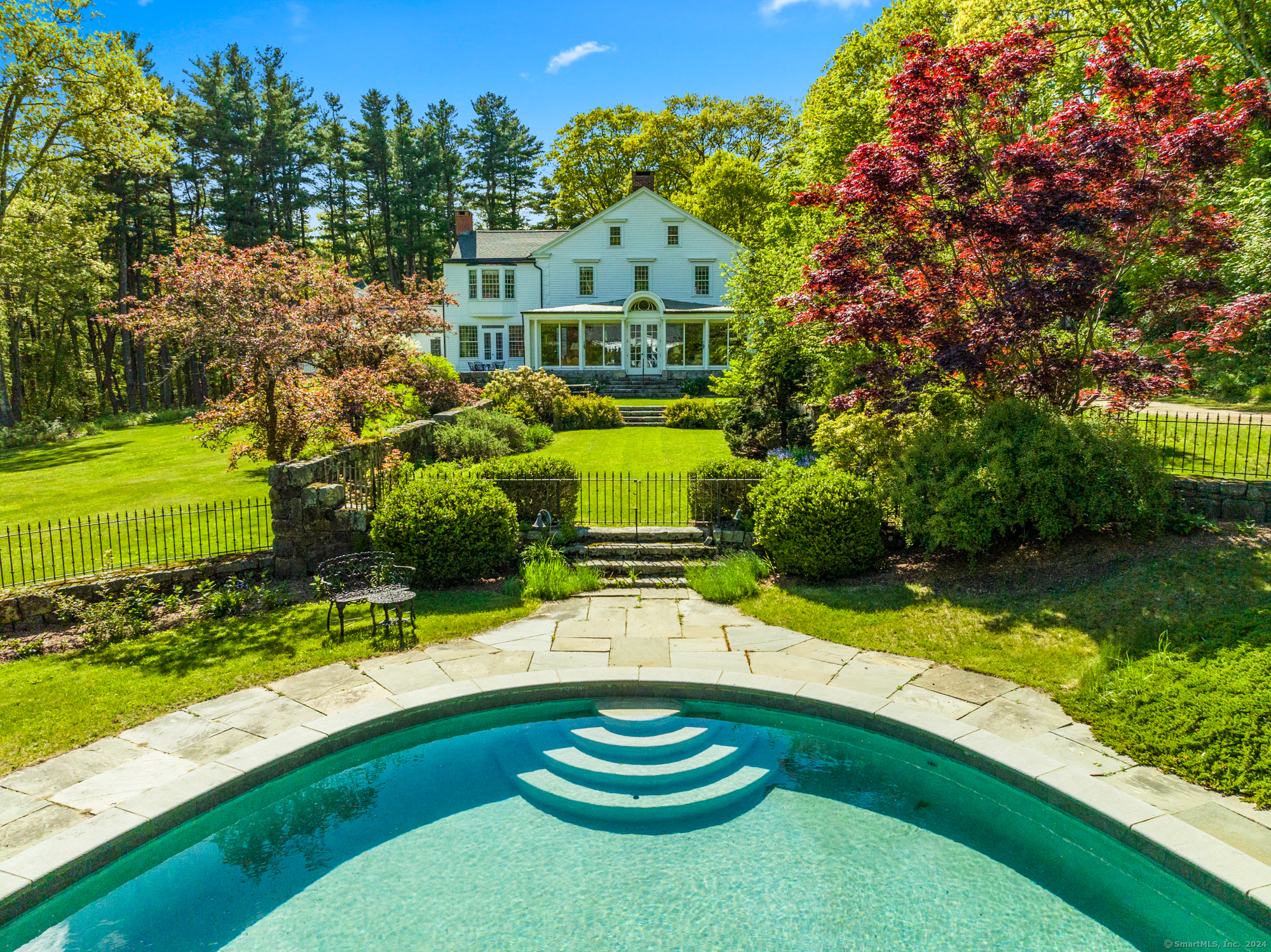 210 Doolittle Drive Norfolk, CT 06058 - Photo 35 of 40 a swimming pool with trees in the background