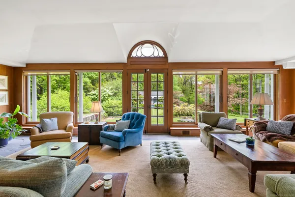 a living room with furniture and a large window