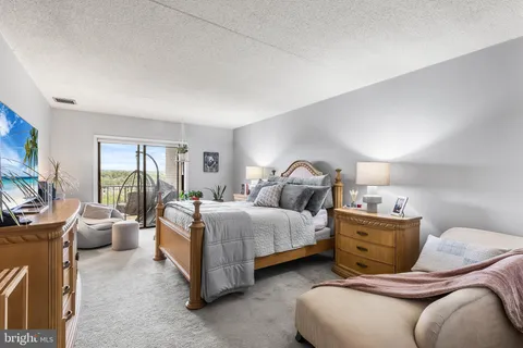 a bedroom with bed and window