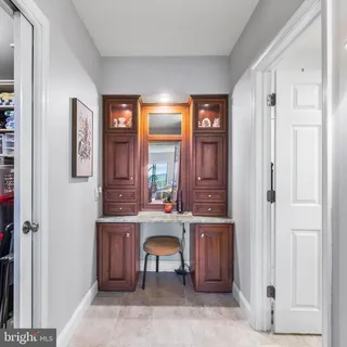a view of a hallway with seating area
