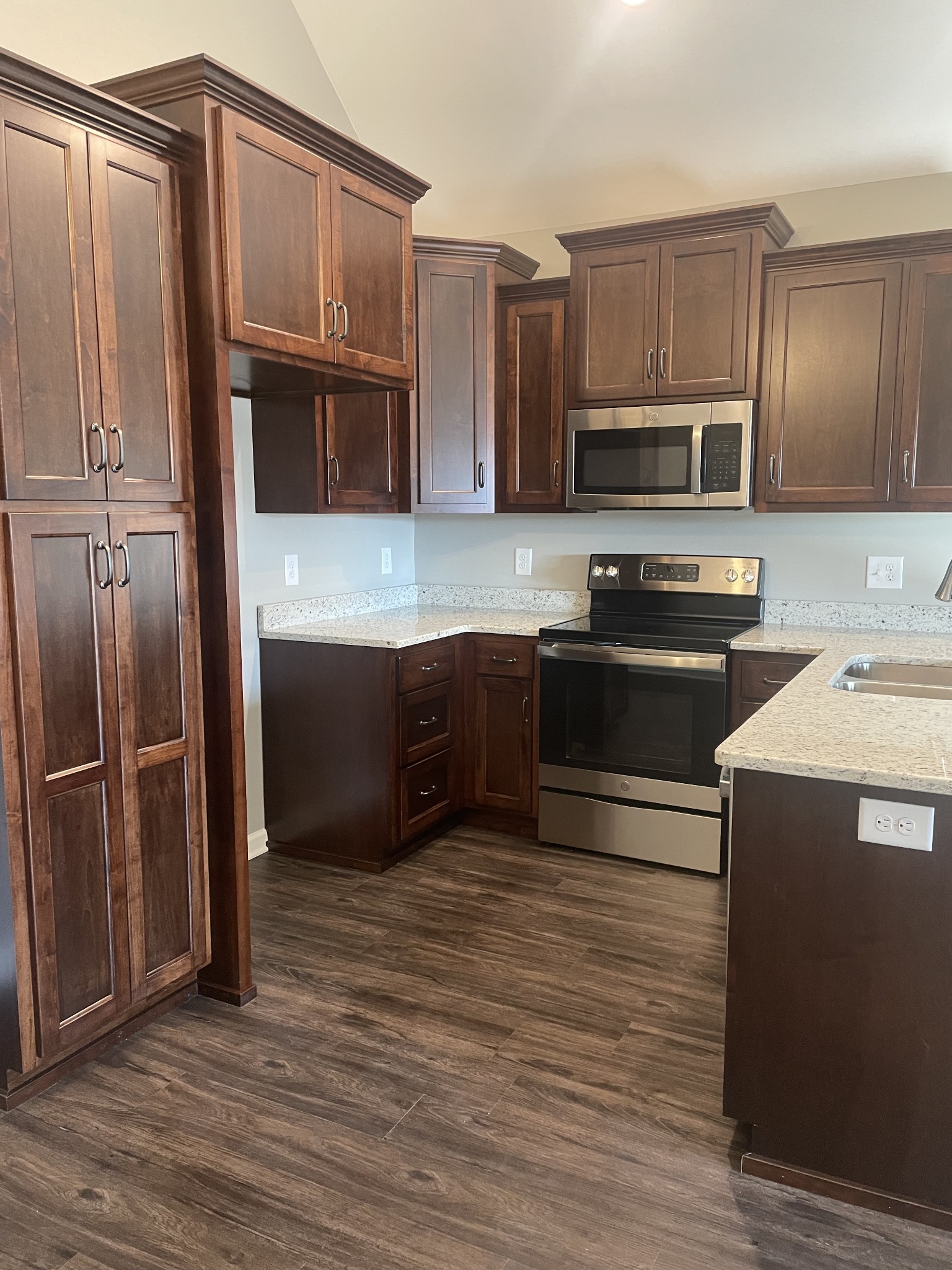 128 Eno Road Dickson, TN 37055 - Photo 2 of 12 a kitchen with stainless steel appliances granite countertop a refrigerator and a stove top oven
