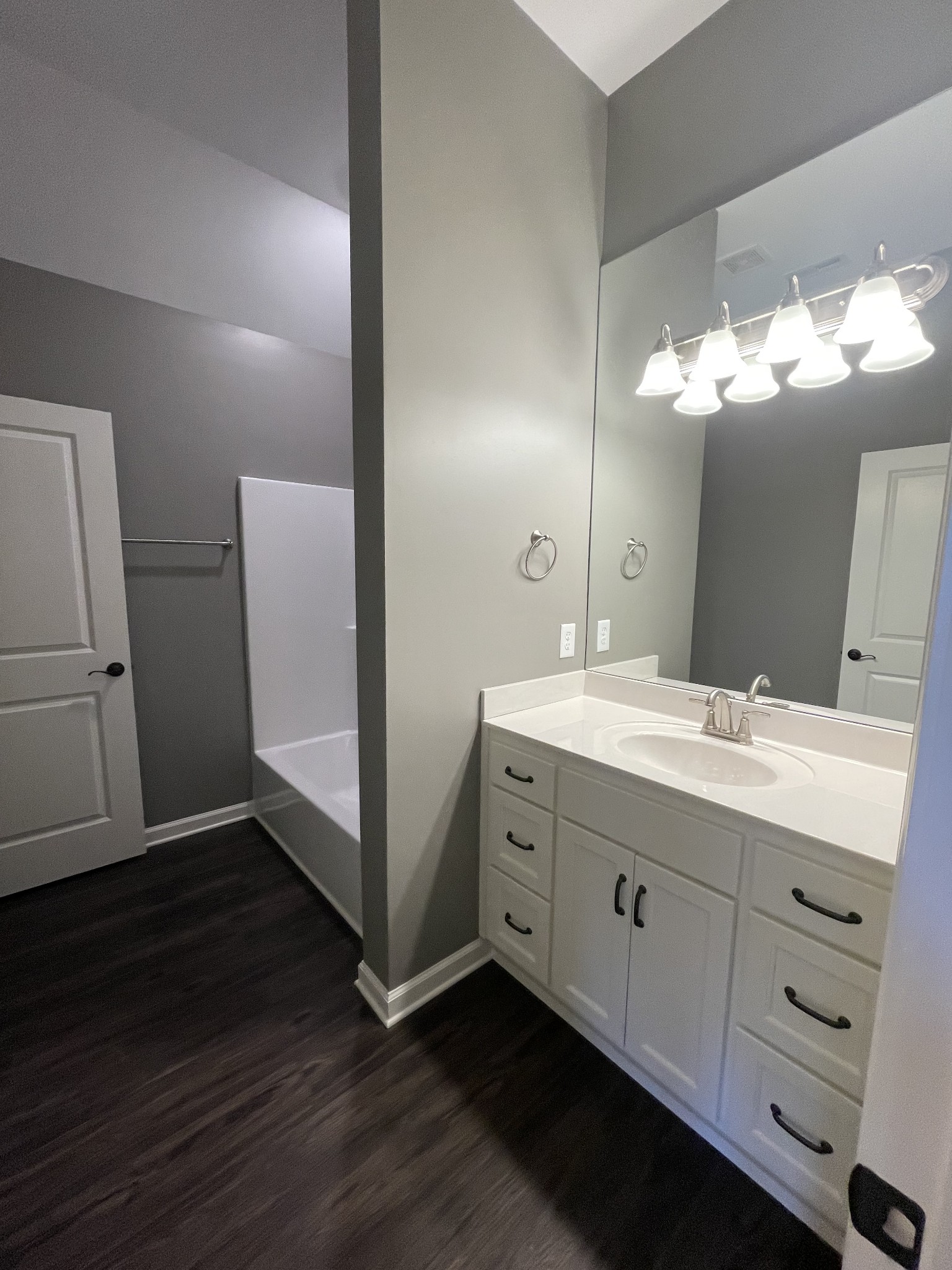 128 Eno Road Dickson, TN 37055 - Photo 6 of 12 a bathroom with a double vanity sink and mirror