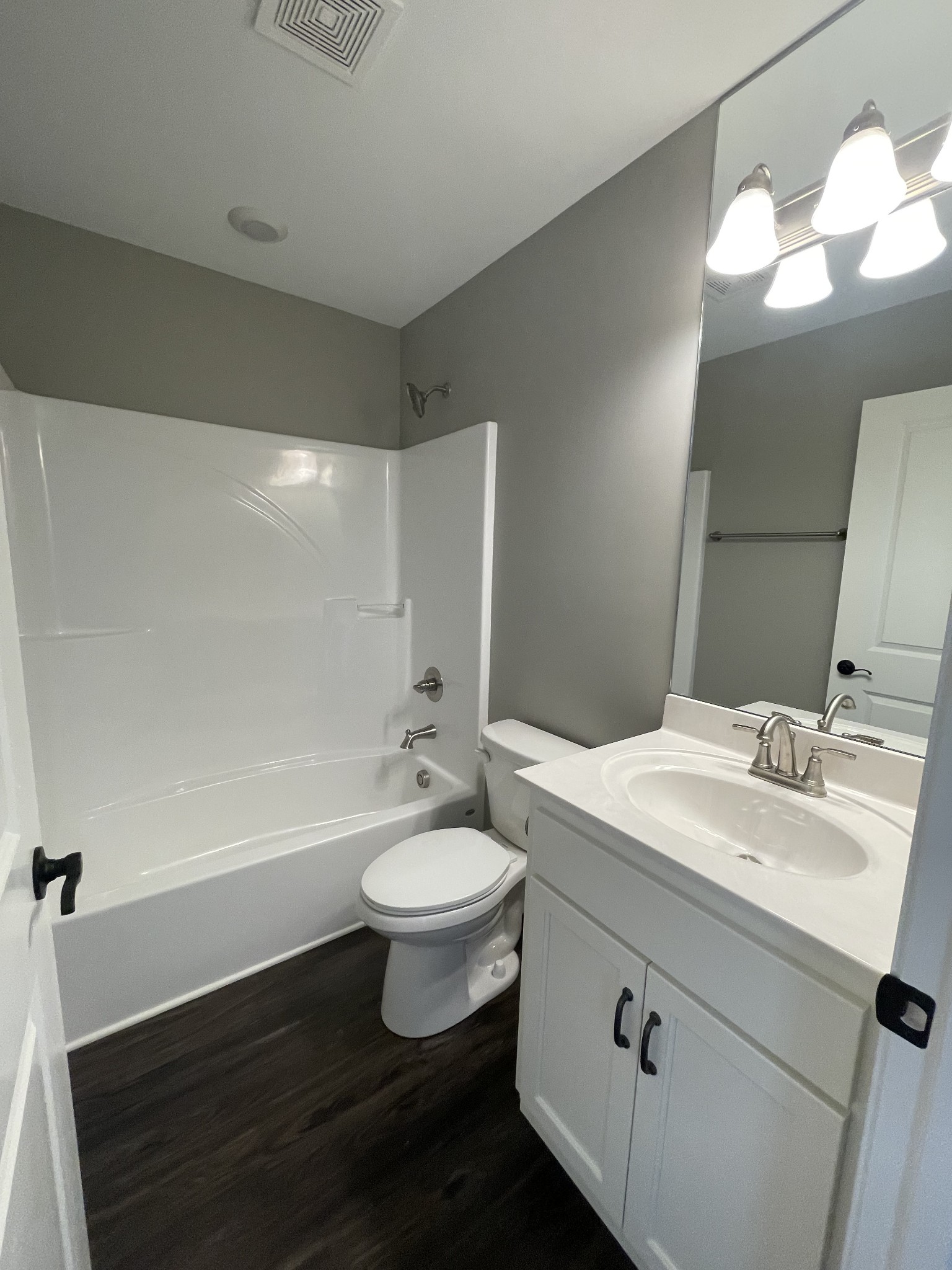 128 Eno Road Dickson, TN 37055 - Photo 9 of 12 a bathroom with a double vanity sink mirror and toilet