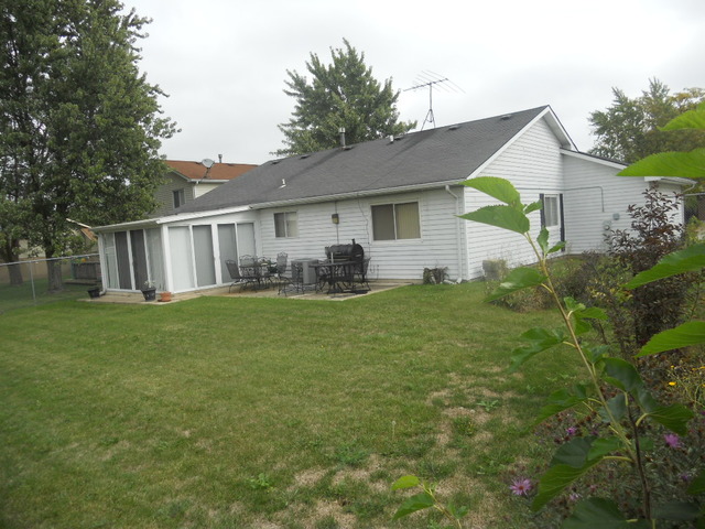 58 Pheasant Road Matteson, IL 60443 - Photo 18 of 20 a front view of house with yard and green space