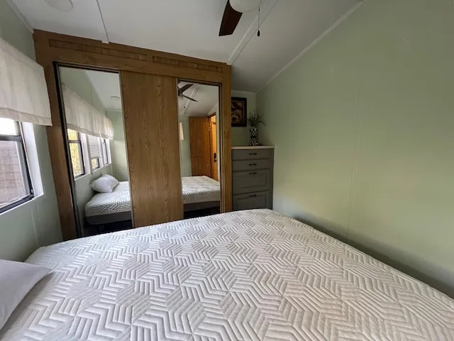a bedroom with a bed and a dresser
