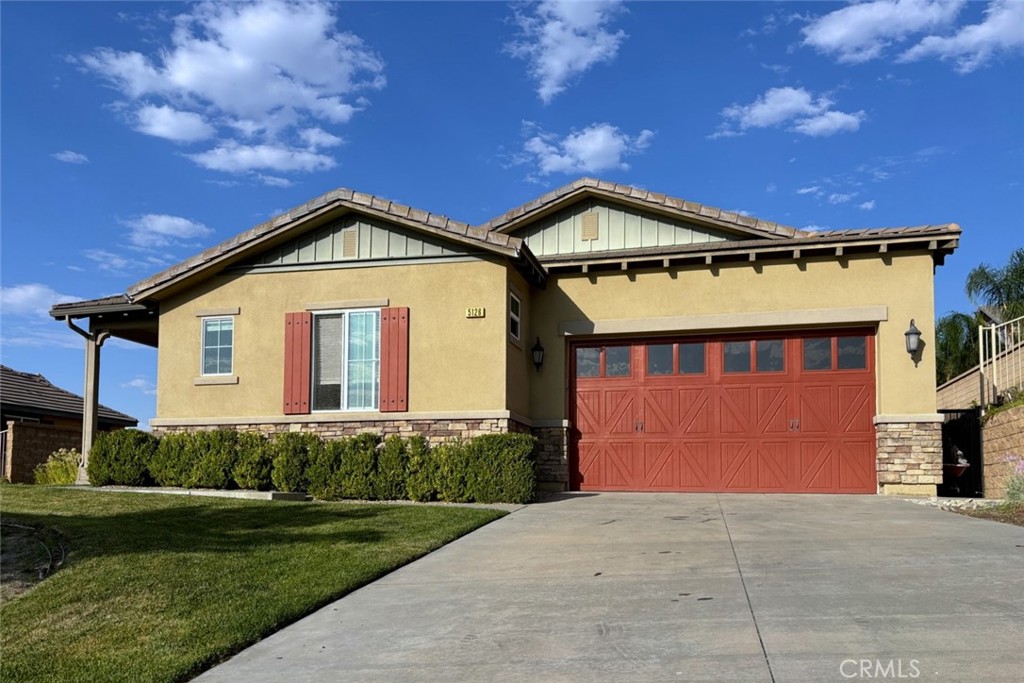 5126 Bering Court Rancho Cucamonga, CA 91739 - Photo 1 of 1 a front view of a house with a yard and garage