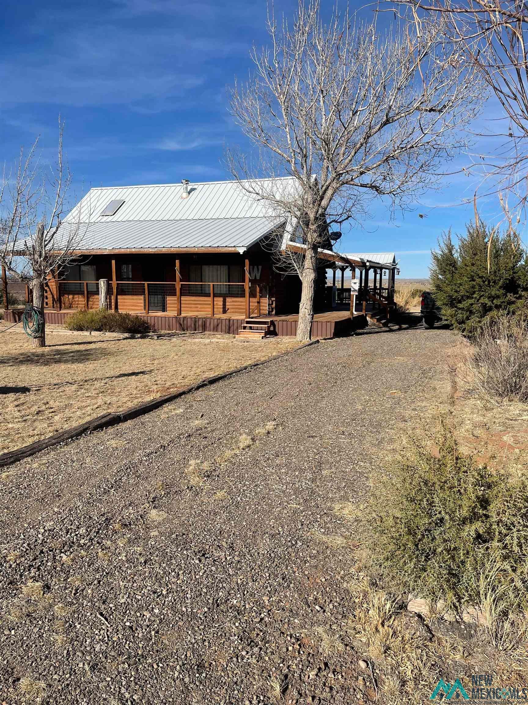 117 Mica Road Conchas Dam, NM 88416 - Photo 3 of 22 View of front of home with a metal roof