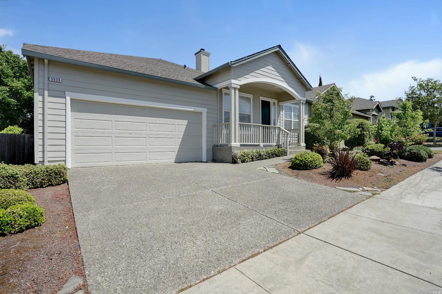 5535 Rainbow Circle Santa Rosa, CA 95409 - Photo 1 of 1 a front view of a house with a yard and garage