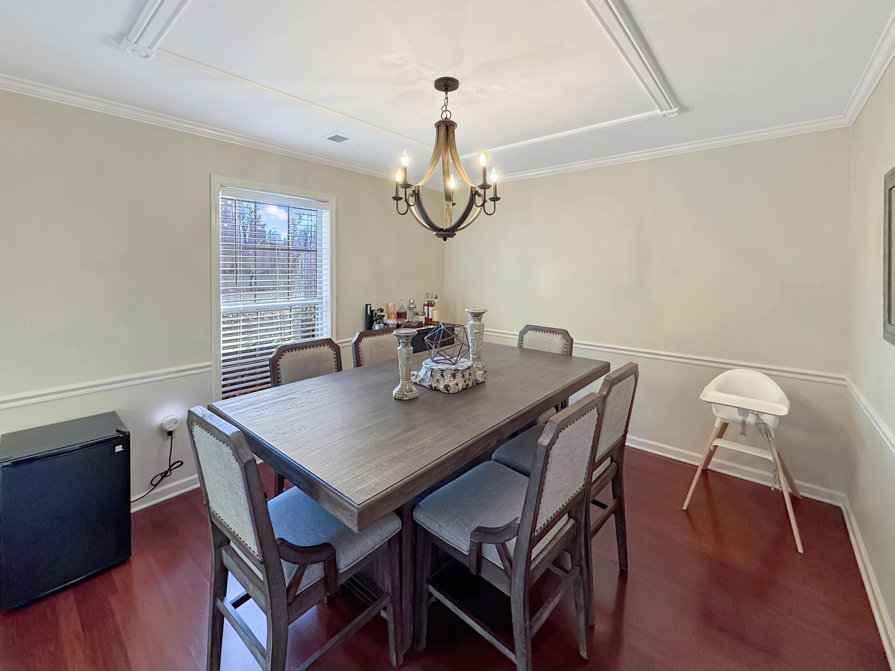 340 Scarlett's Way Collierville, TN 38017 - Photo 17 of 40 Dining room with dark wood-type flooring, a chandelier, and crown molding