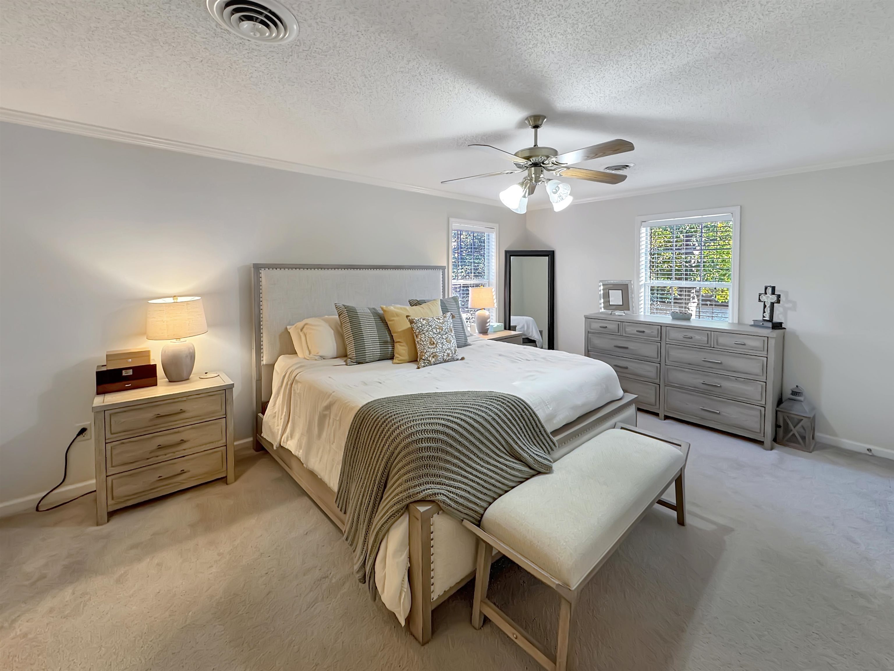 340 Scarlett's Way Collierville, TN 38017 - Photo 20 of 40 Bedroom with crown molding, light carpet, a textured ceiling, and a ceiling fan