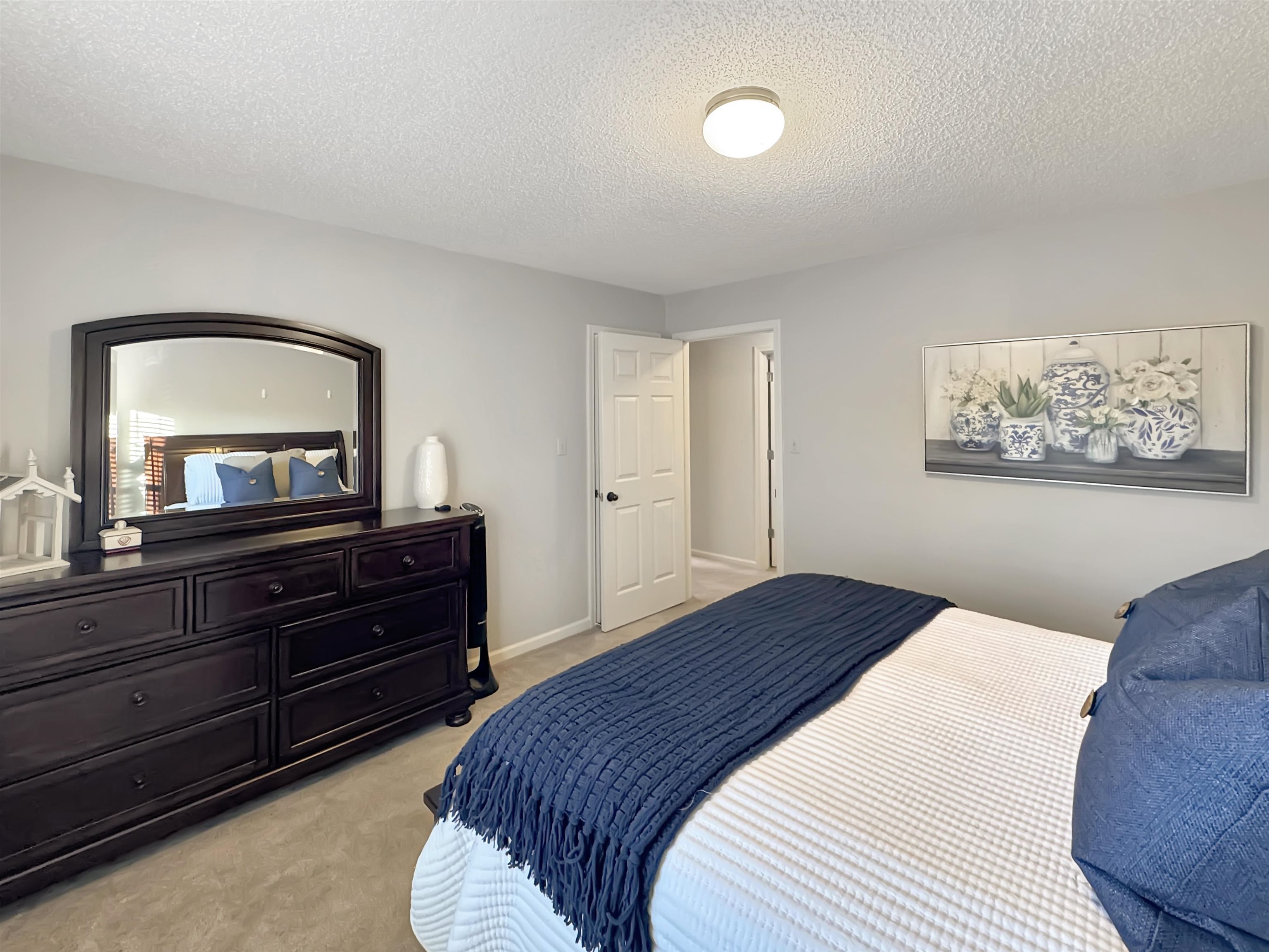 340 Scarlett's Way Collierville, TN 38017 - Photo 33 of 40 Bedroom featuring light carpet and a textured ceiling