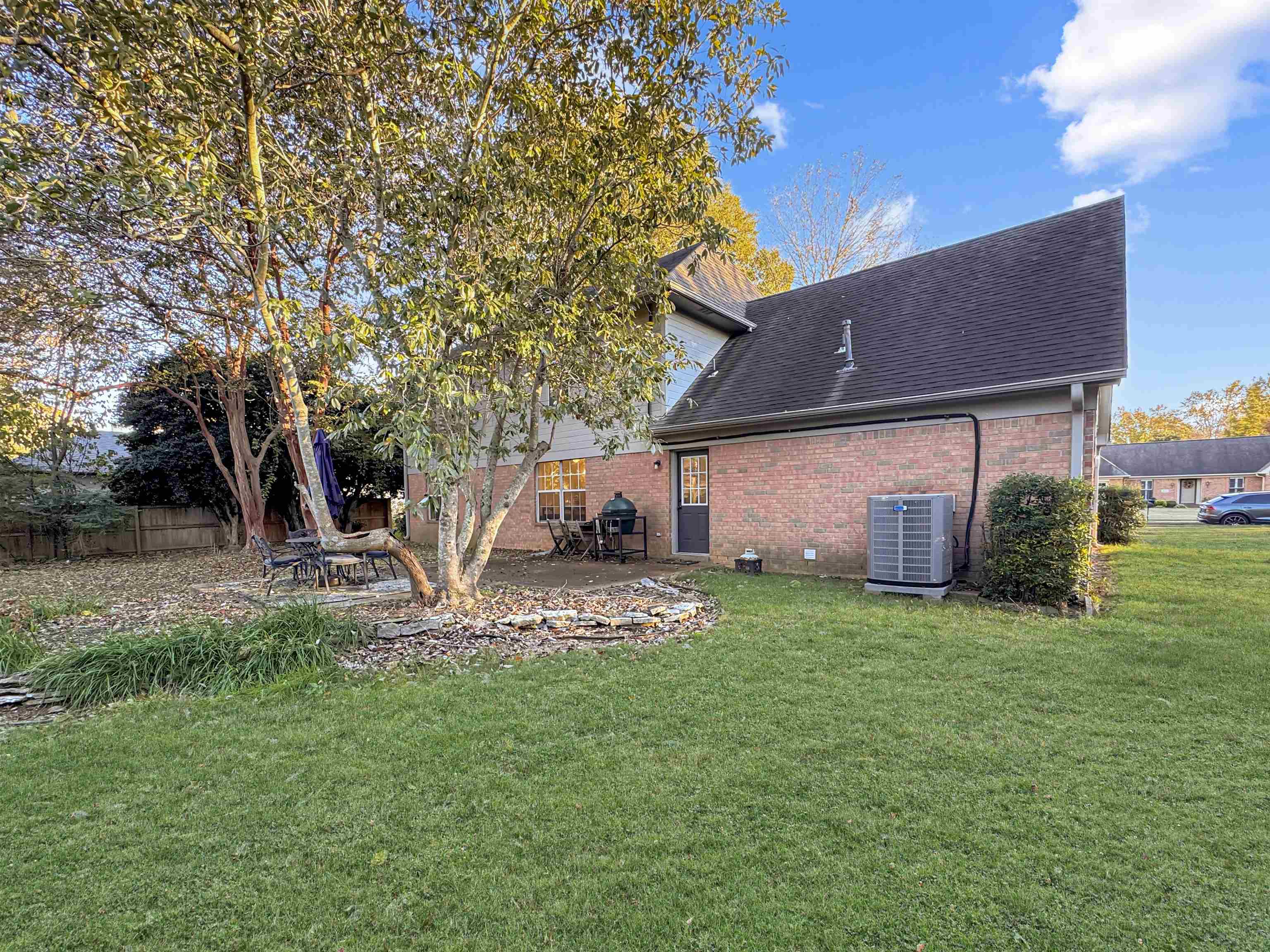 340 Scarlett's Way Collierville, TN 38017 - Photo 39 of 40 Rear view of property featuring brick siding, roof with shingles, and a patio area
