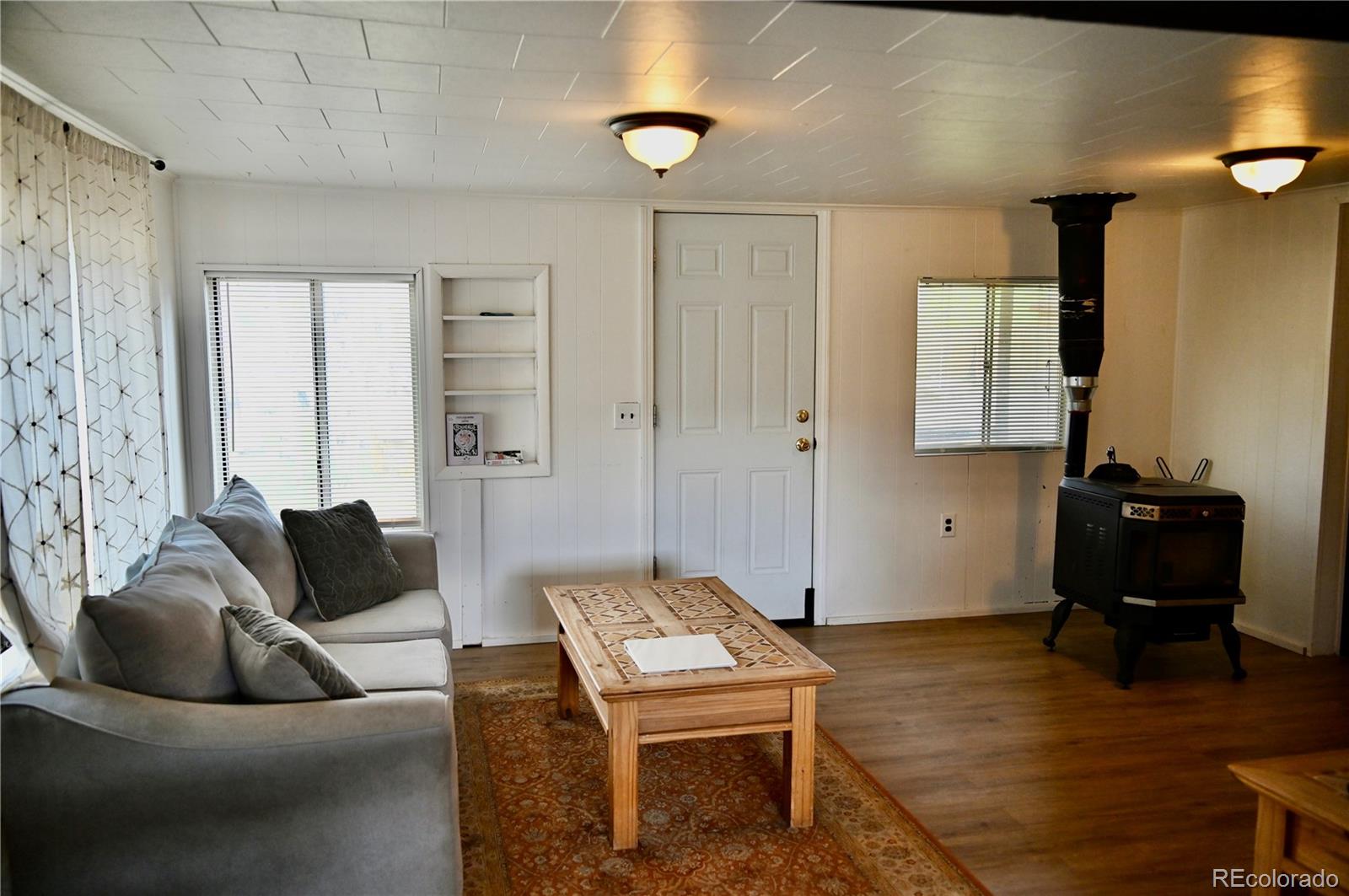 1516 Heeney Road Silverthorne, CO 80498 - Photo 6 of 16 a living room with furniture and a wooden floor