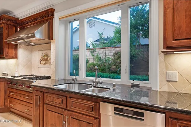 a view of a livingroom with furniture and a hallway