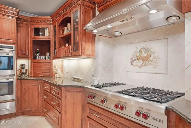 a spacious bathroom with a tub sink and mirror