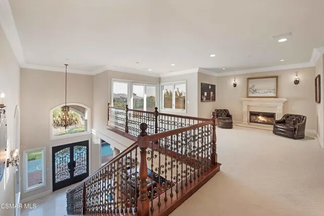 a spacious bathroom with a double vanity sink a mirror a bathtub and a toilet