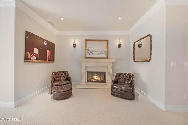 a bathroom with a granite countertop double vanity sink and a mirror