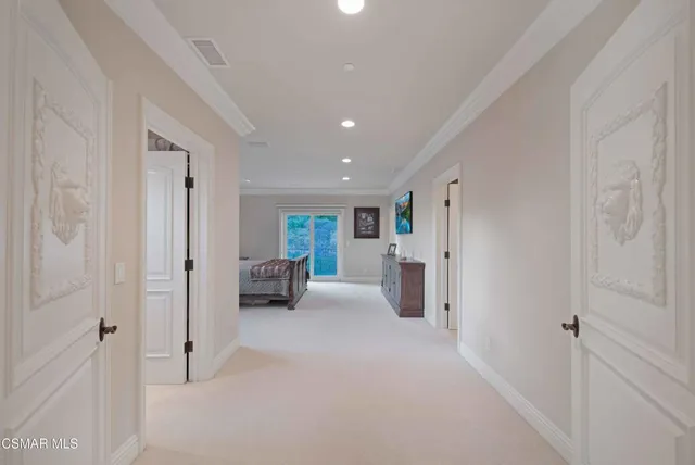 a room with lots of furniture and a chandelier