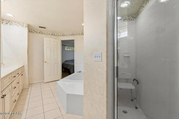 a bathroom with a bathtub and a shower