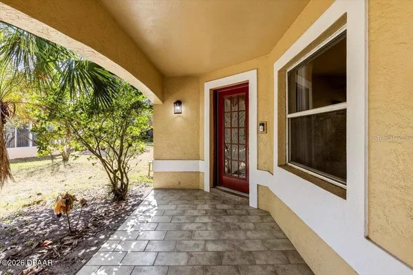 a view of a door and a yard