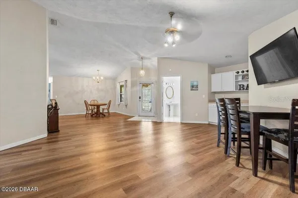 a view of a kitchen and dining room