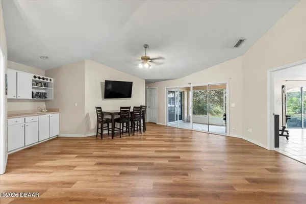 a view of a livingroom with furniture and a flat screen tv