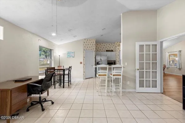 a view of a livingroom with furniture and window