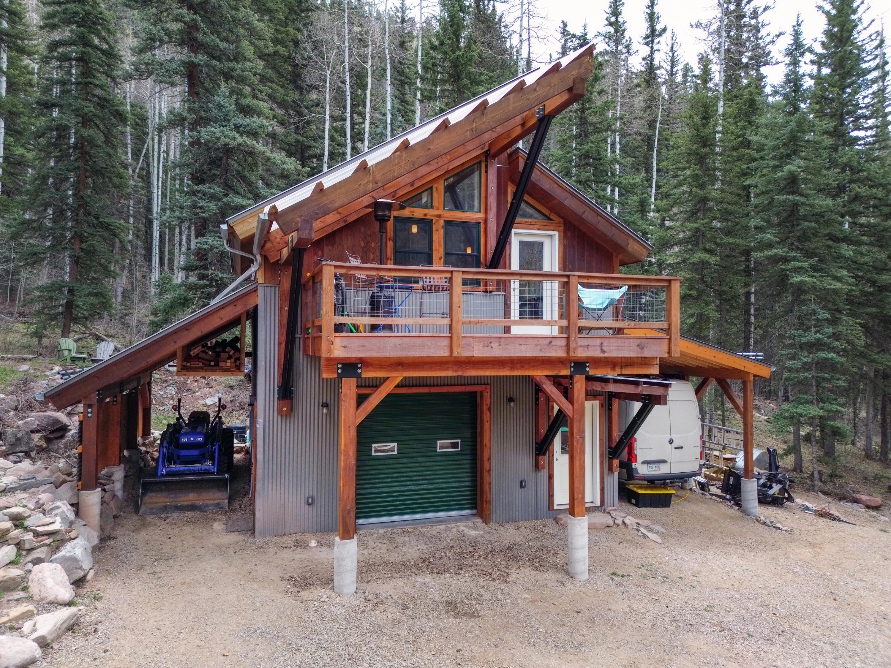 15322 Road 55.9 Rico, CO 81332 - Photo 17 of 32 a view of a house with a balcony and trees