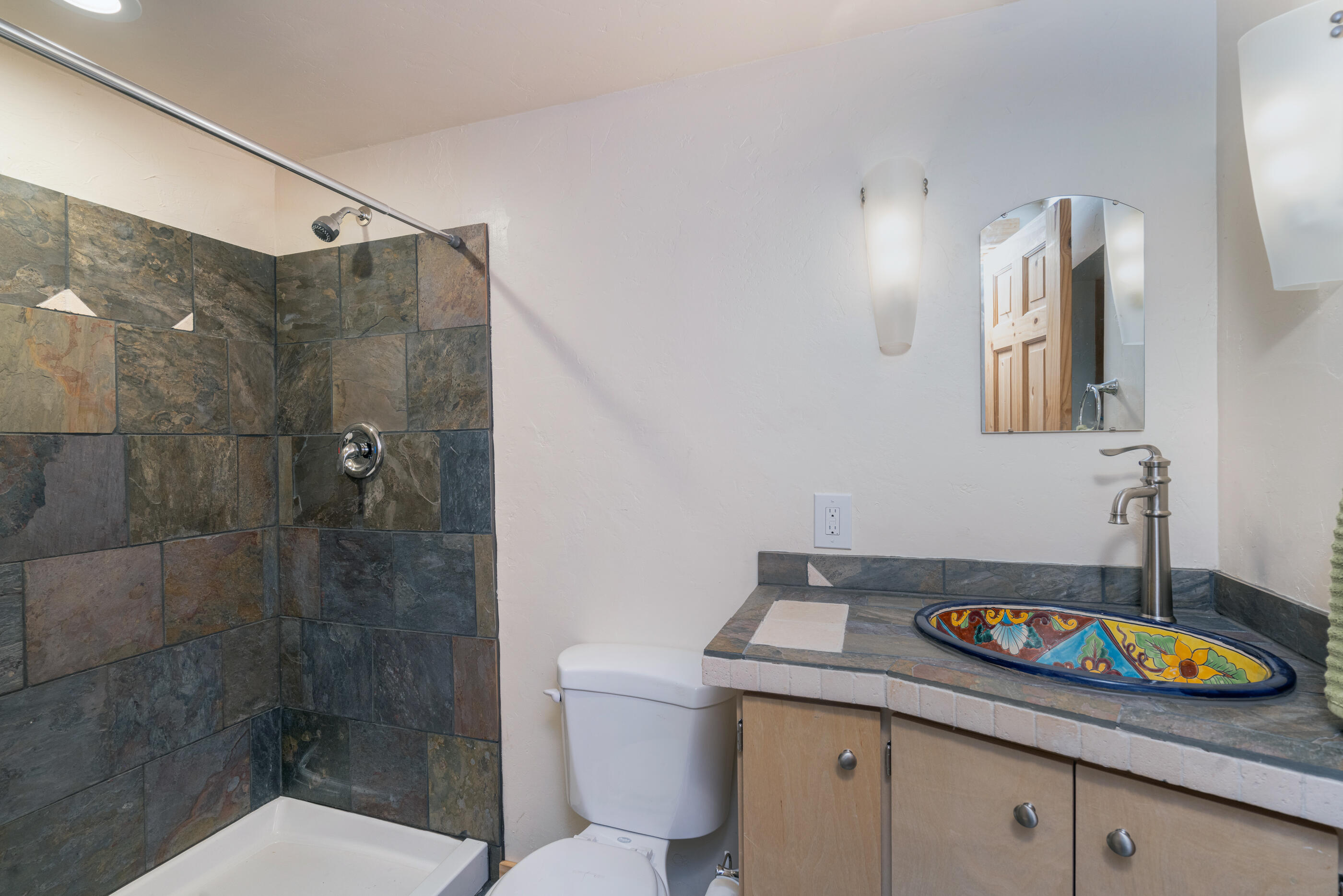 15322 Road 55.9 Rico, CO 81332 - Photo 20 of 32 a bathroom with a granite countertop sink a toilet and shower