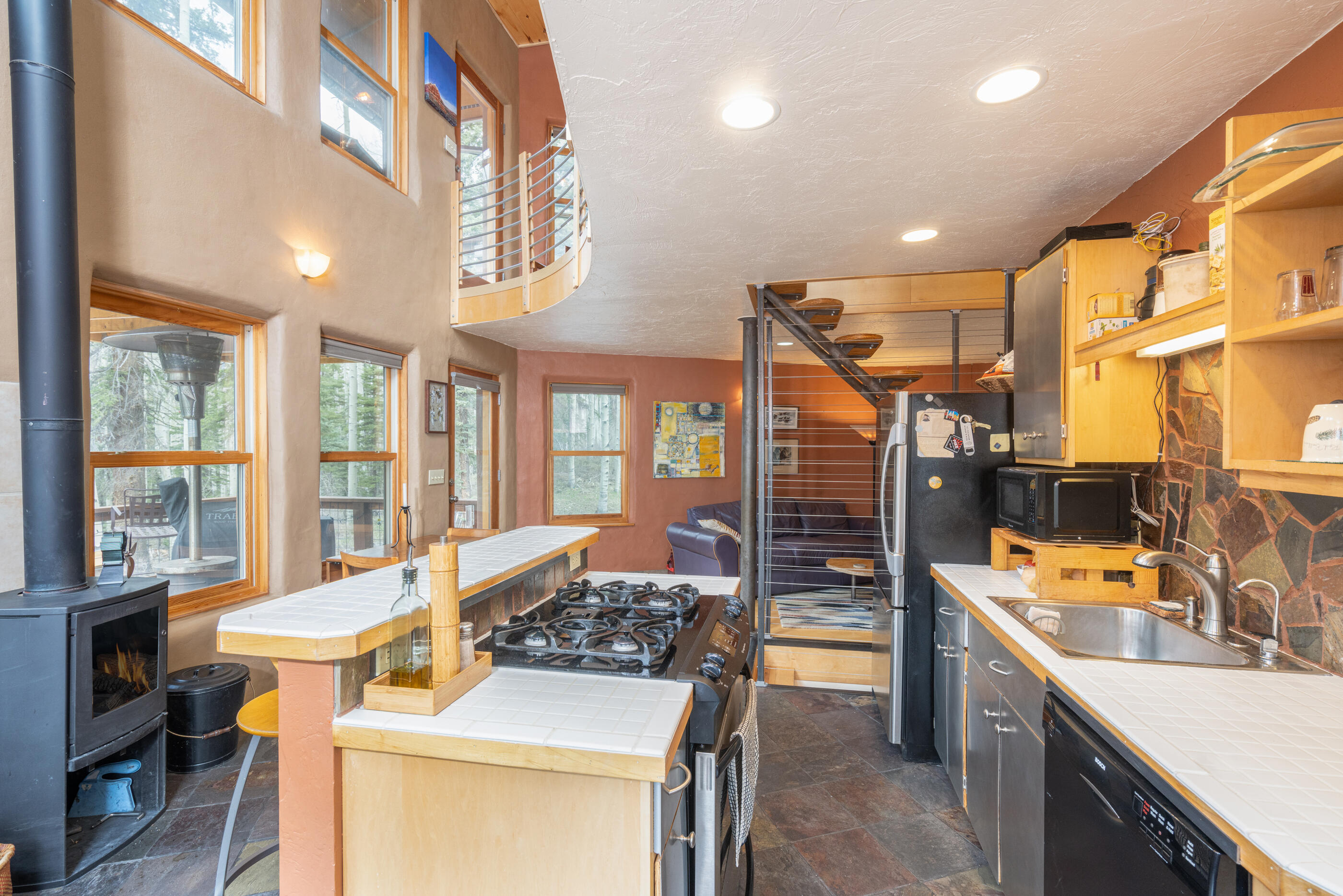 15322 Road 55.9 Rico, CO 81332 - Photo 4 of 32 a kitchen with a sink stove and cabinets