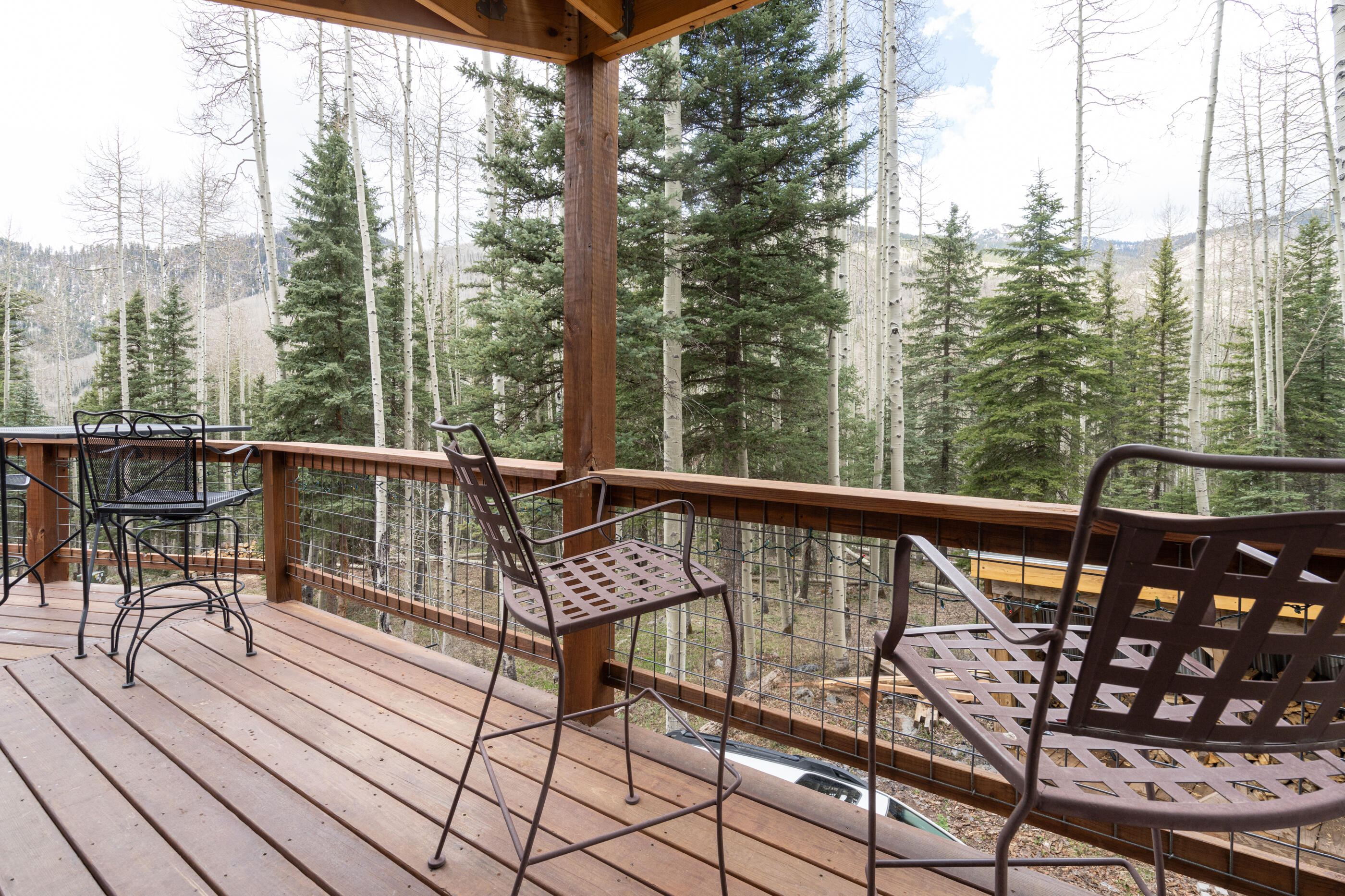 15322 Road 55.9 Rico, CO 81332 - Photo 10 of 32 a view of a balcony with chairs and wooden fence