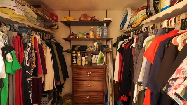 a view of a livingroom with furniture and stairs