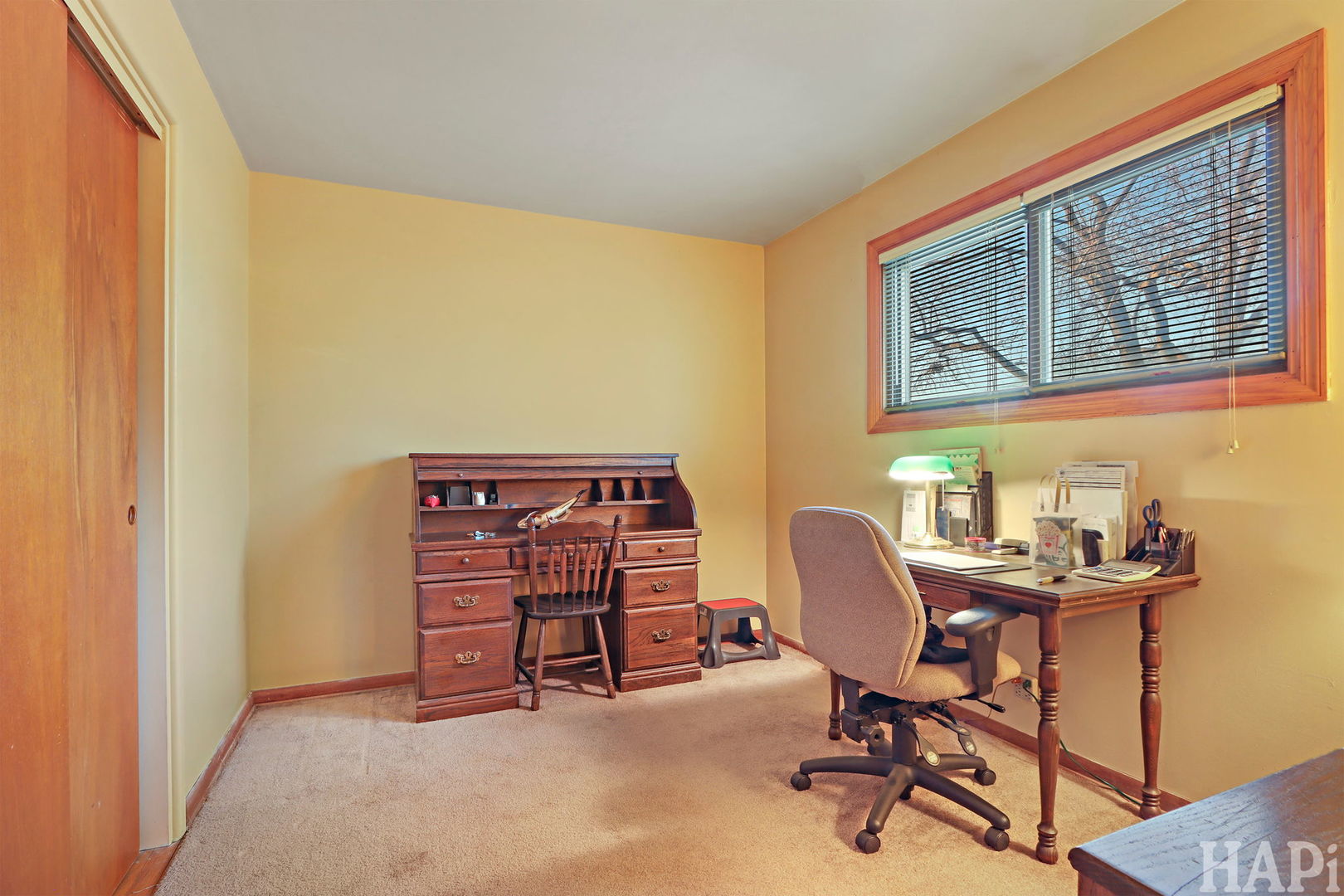 411 West Diversey Avenue Addison, IL 60101 - Photo 13 of 23 a view of a workspace with furniture and a window