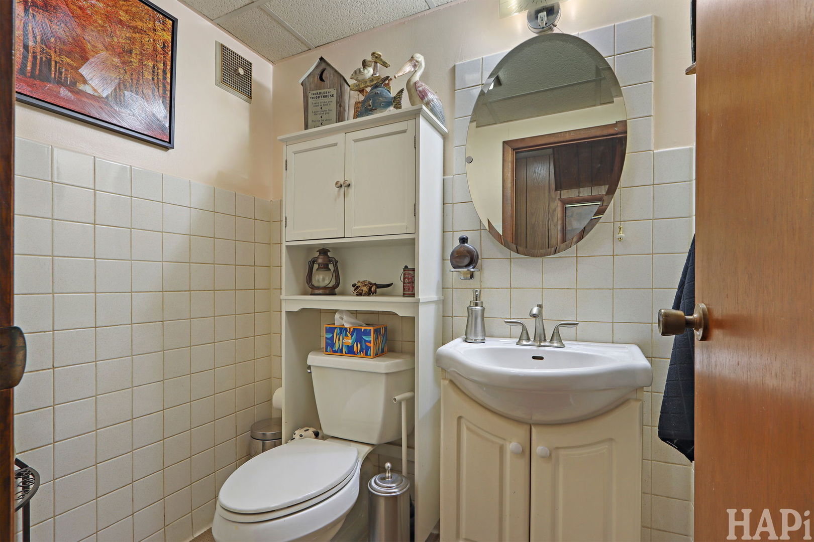 411 West Diversey Avenue Addison, IL 60101 - Photo 14 of 23 a bathroom with a sink a toilet and a mirror