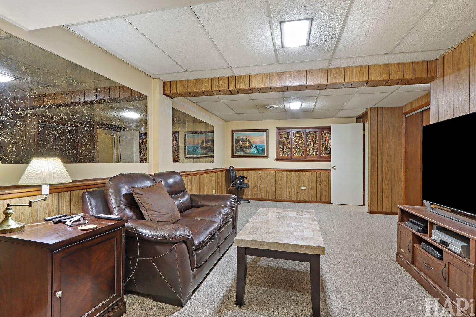 411 West Diversey Avenue Addison, IL 60101 - Photo 15 of 23 a living room with furniture and a flat screen tv
