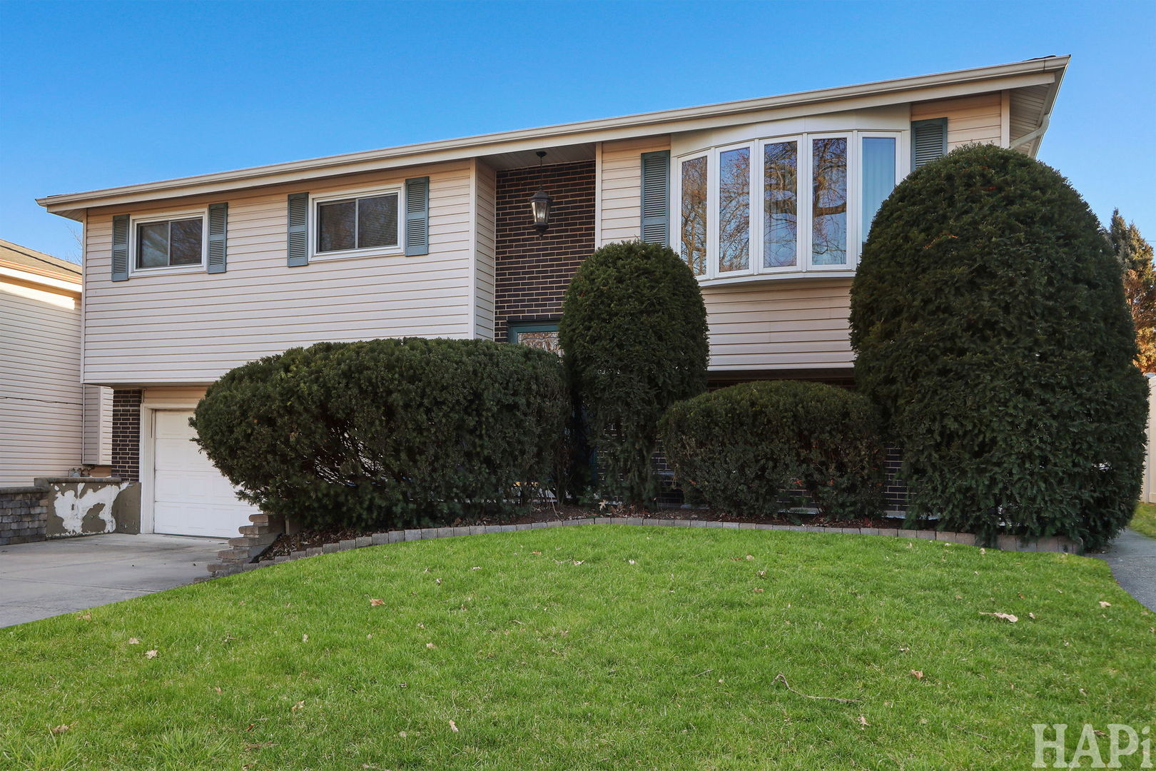 411 West Diversey Avenue Addison, IL 60101 - Photo 2 of 23 a view of house with backyard and garden