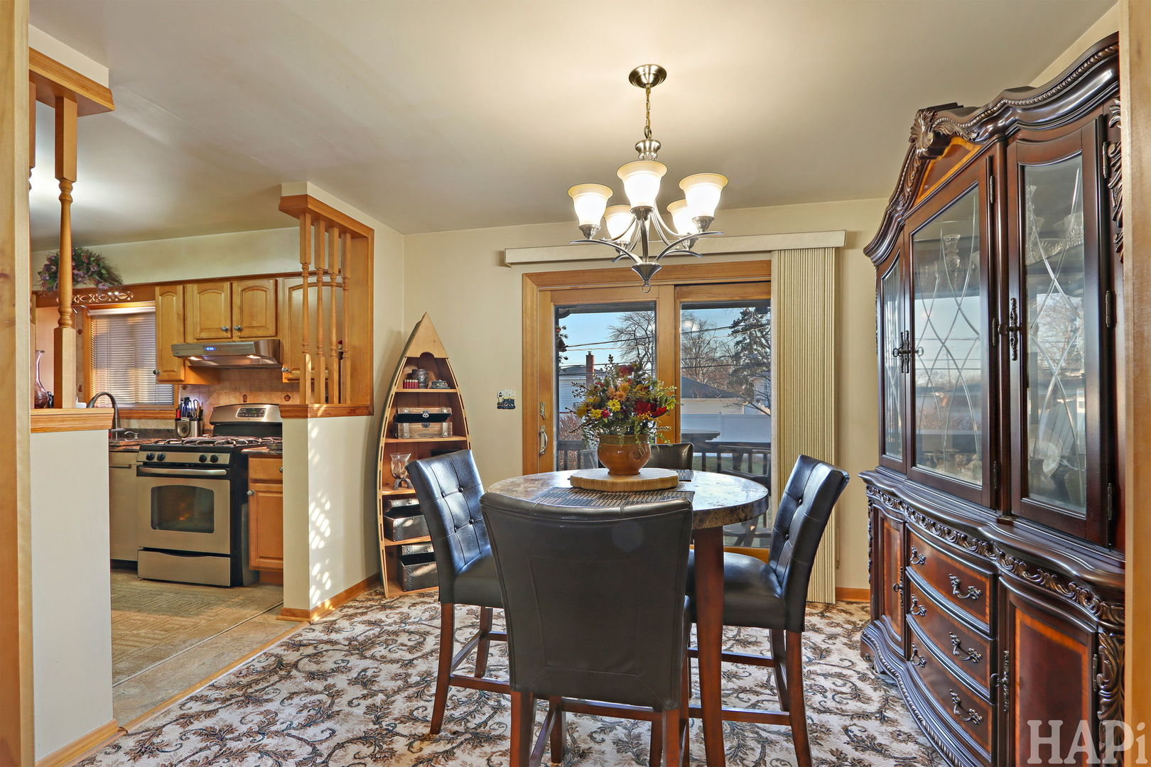 411 West Diversey Avenue Addison, IL 60101 - Photo 6 of 23 a view of a dining room with furniture wooden floor and chandelier