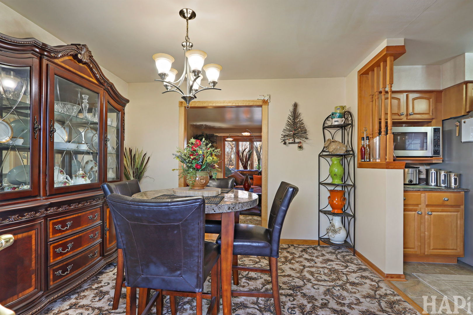 411 West Diversey Avenue Addison, IL 60101 - Photo 7 of 23 a view of a dining room with furniture and a chandelier