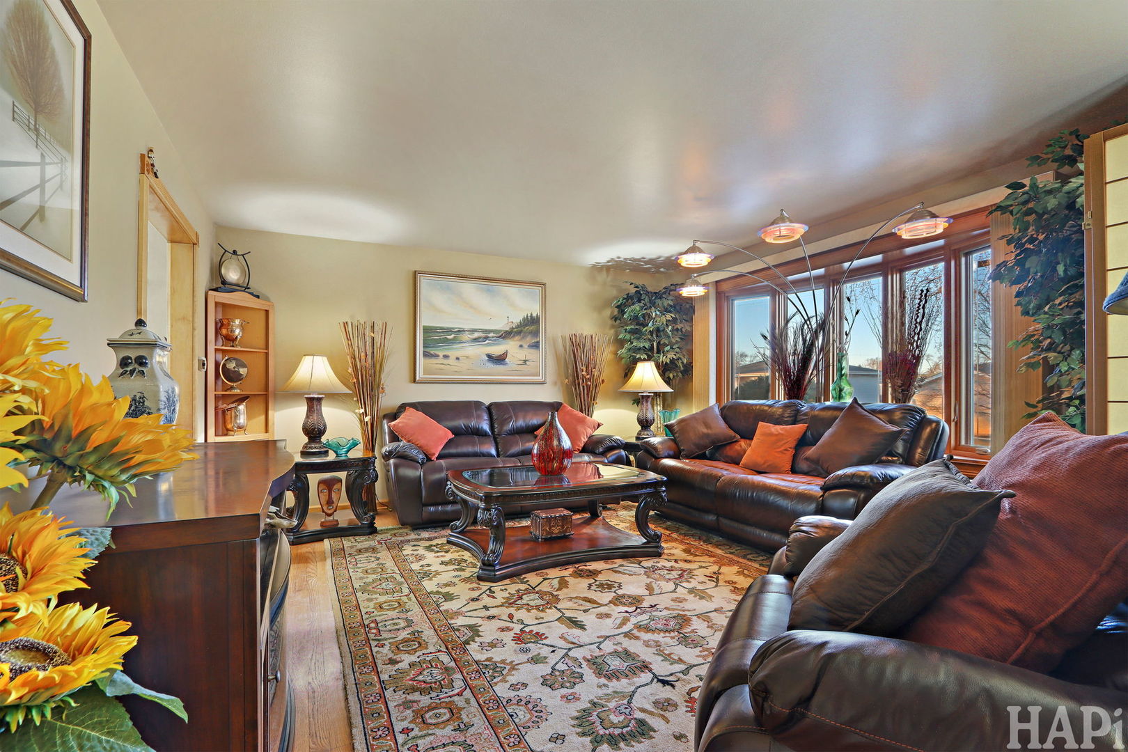 411 West Diversey Avenue Addison, IL 60101 - Photo 8 of 23 a living room with furniture fireplace and a large window