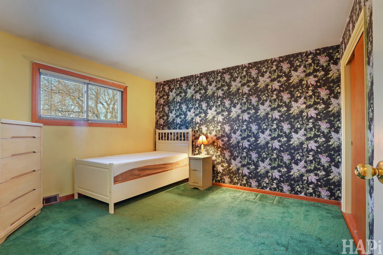 411 West Diversey Avenue Addison, IL 60101 - Photo 10 of 23 a room with a bed and a wall painting