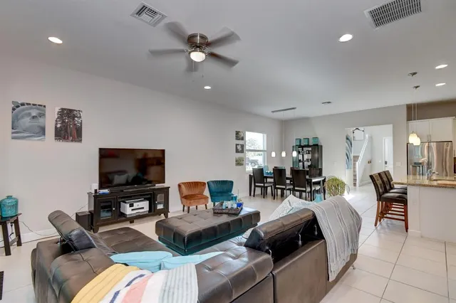 a bedroom with a bed and a dresser in it