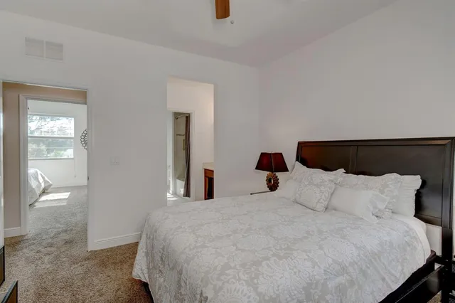 a bathroom with a sink vanity mirror and toilet