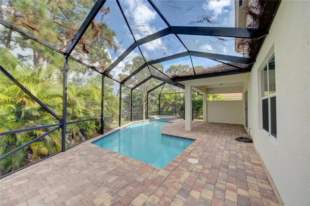 a view of swimming pool with a bench in balcony